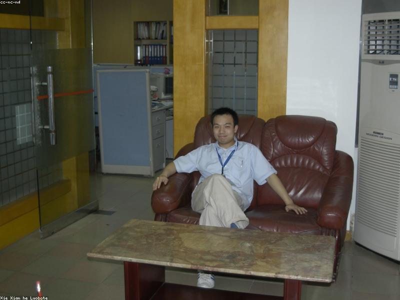 Business professionals in a modern Chinese office at night