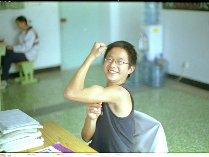 Chinese students studying in a classroom with books