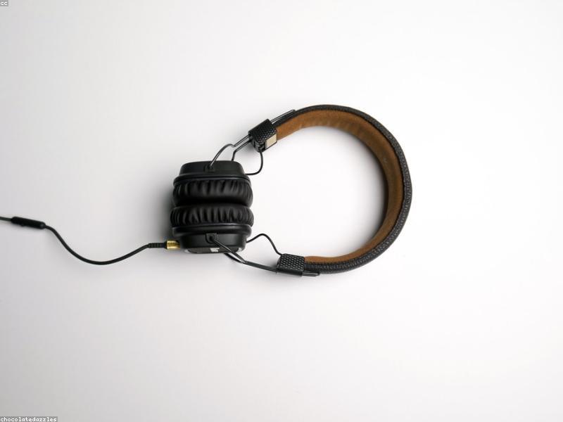 Person wearing headphones listening to audio while walking